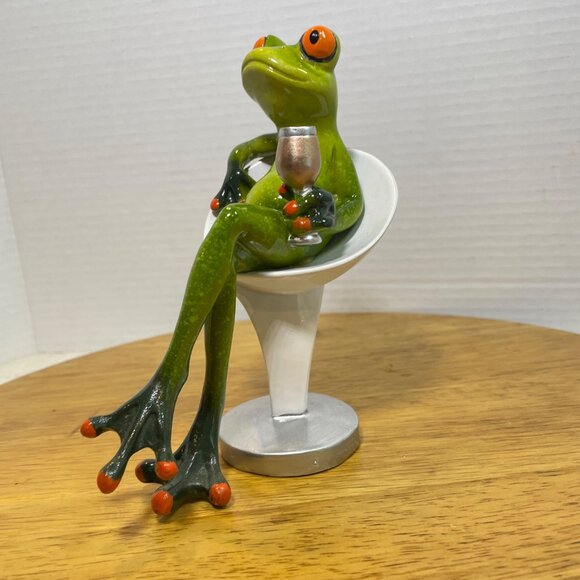 Green Ceramic Frog Figurine With Wine Glass Sitting In Modern White Chair - Picture 7 of 10